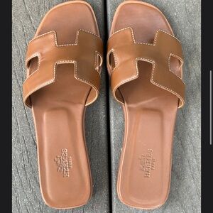 Hermes Slides. Brown